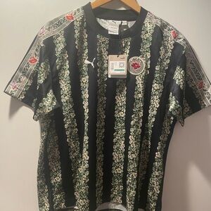 Puma Women's Black and Green Floral Stripe Jersey